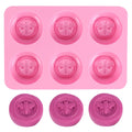 Pink round silicone mold with honeybee design for making homemade soaps, lotion bars, jello, bath bombs, or chocolates.