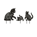 Set of three black metal cat silhouette garden stakes for outdoor yard and patio decoration, ideal for lawn and garden decor.