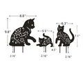 Set of three black metal garden stakes with cat silhouette designs, decorative yard and outdoor lawn ornaments for garden decor.