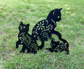 Set of three black metal garden stakes featuring cat silhouette designs for yard and outdoor lawn decoration.