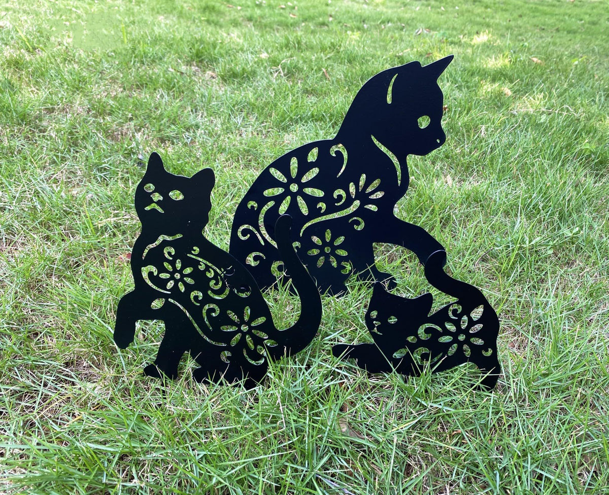 Set of three black metal garden stakes featuring cat silhouette designs for yard and outdoor lawn decoration.