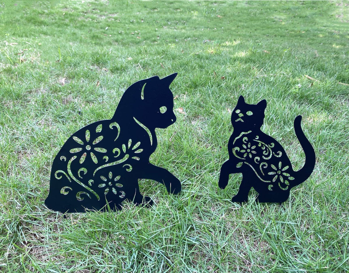 Set of three black metal garden stakes with cat silhouette designs for outdoor yard, lawn, and patio decoration.