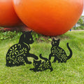 Set of three black metal garden stakes featuring playful black cat silhouettes for yard outdoor lawn patio decoration.