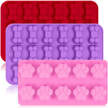 Pink, red, and purple paw and bone-shaped bakeware set for chocolate and candy, microwave, oven, freezer, and dishwasher safe.