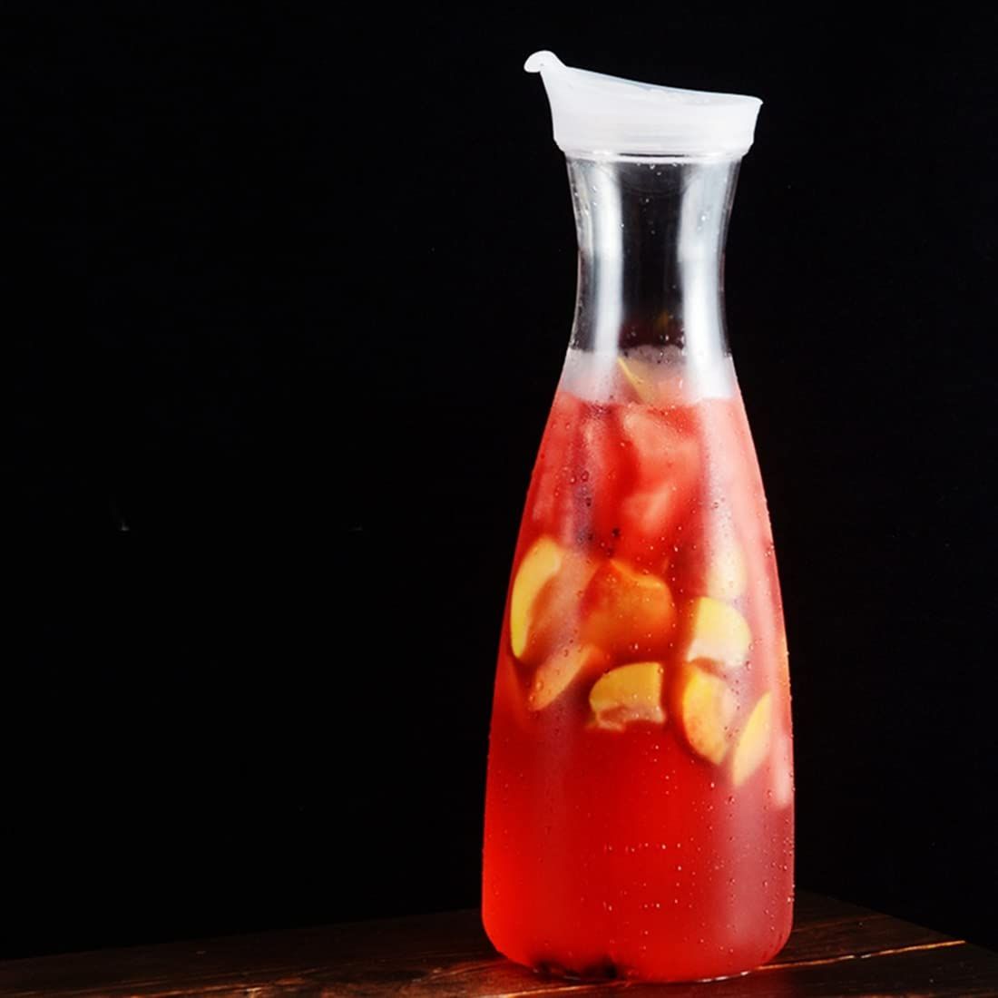 Acrylic water carafe with flip top lid, food-grade, recyclable, shatterproof pitcher for water, iced tea, or juice.