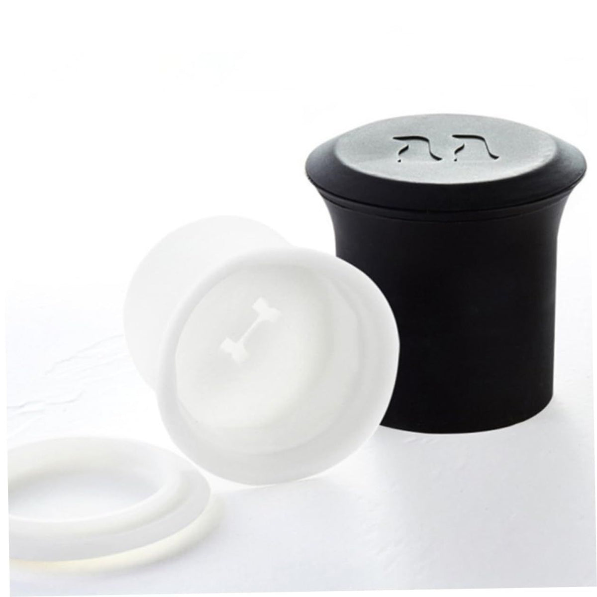 Two 3D silicone ice cube trays with polar bear and penguin shapes for making fun ice cubes for whiskey or drinks.