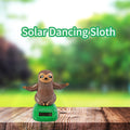 Solar dancing figures toy by Everything Baby, shaking hand doll for car dashboard, desk, or windowsill decoration.