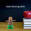 Solar dancing figure toy from Everything Baby, a shaking hand doll for car dashboards, desks, or windowsills.