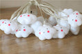 Cute cloud-shaped baby night light with a face, warm white glow, perfect for kids' room decor and pretend play.