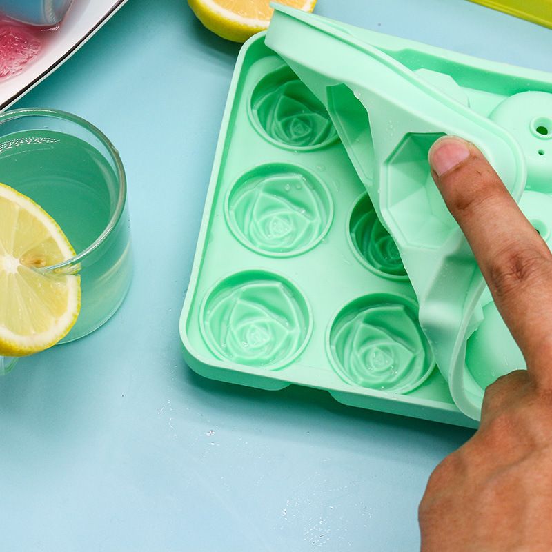 Two rose flower-shaped silicone ice cube molds with lids, reusable ice cube and ice cream maker tools for baby and kids feeding.