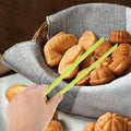 Silicone food clip by Everything Baby, used for sushi, barbecue, steak, and kimchi, in a kitchen setting with baby and kids feeding tools.