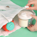 Non-spill rotating four-compartment formula container for kids, baby milk powder and snacks, ideal for toddler travel and outdoor use.