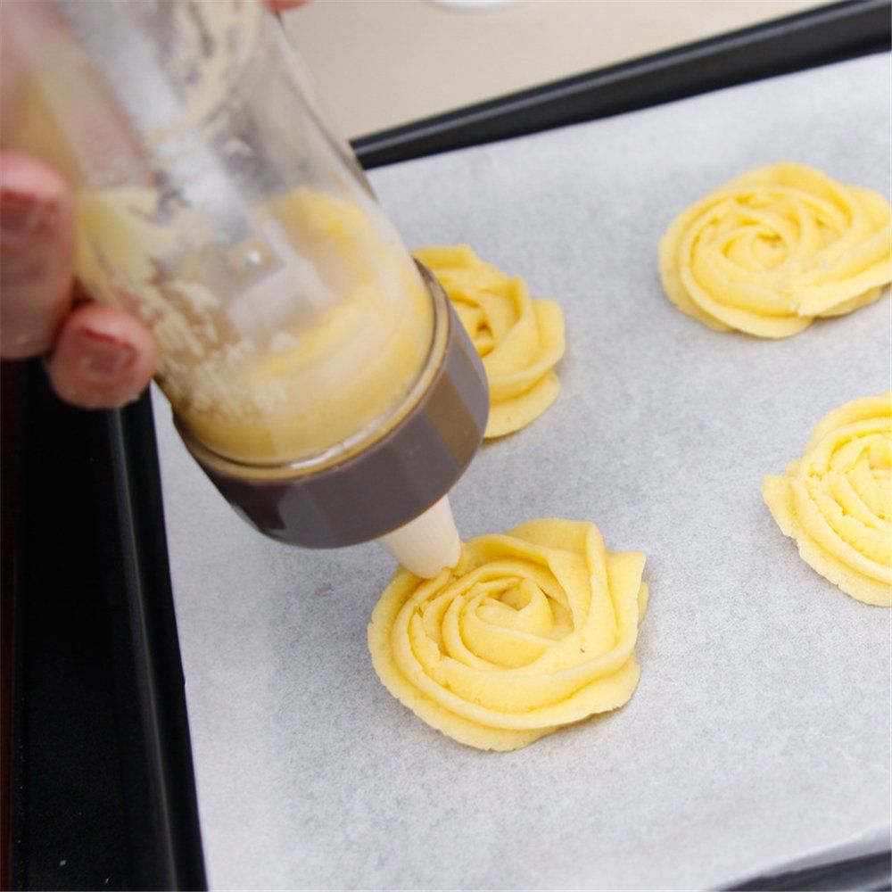 20-piece baby biscuit making and frosting set with press, frosting gun, and decorating tools for kids' baking and feeding.