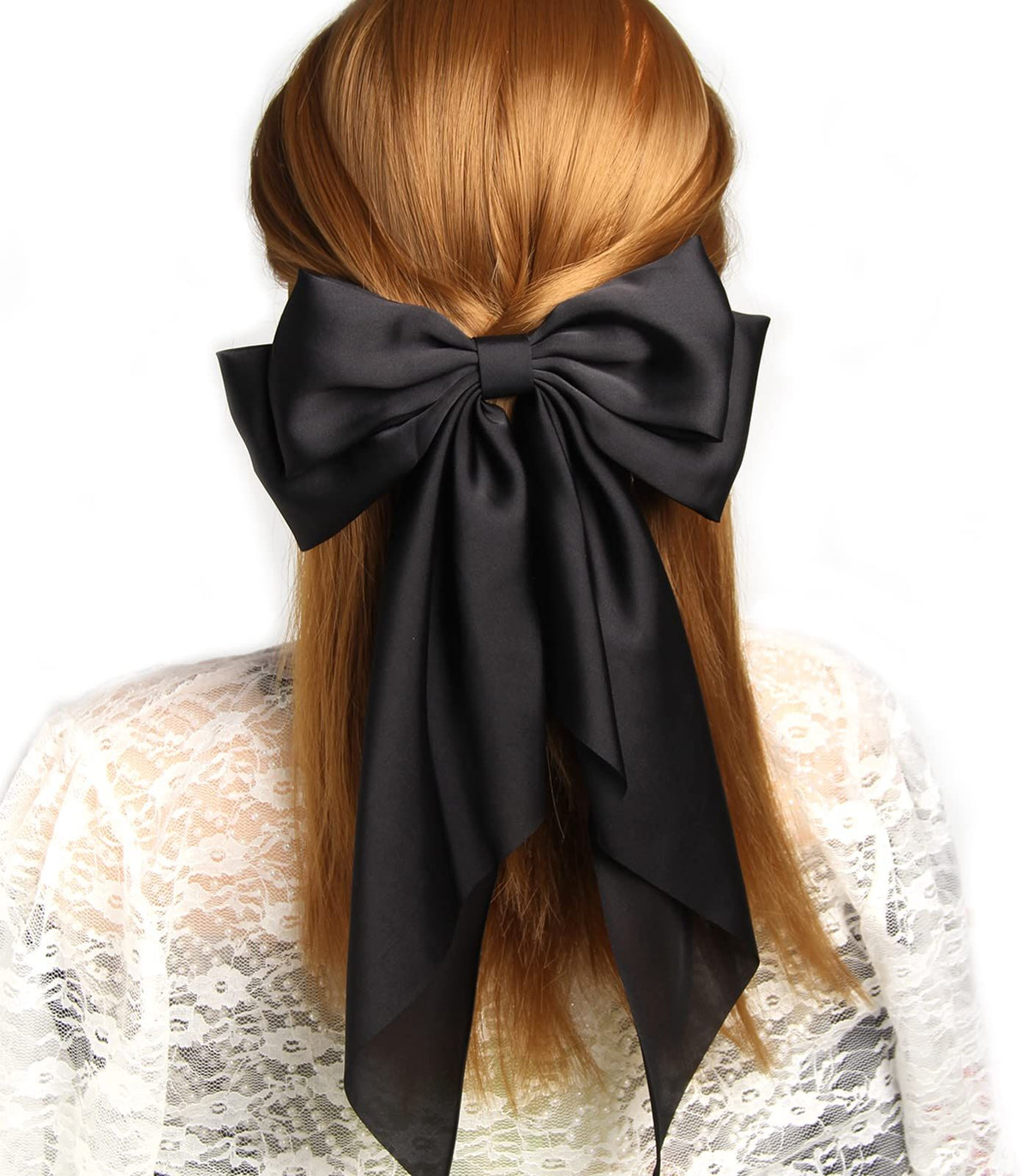 Black satin hair bow barrette with long ribbon for girls, stylish hair clip accessory for parties and special occasions.