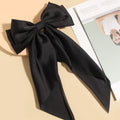 Black satin hairbow barrettes with long ribbon for girls, stylish hair clips perfect for parties and special occasions.
