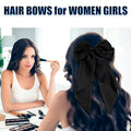 Black satin hair bow barrette with long ribbon, stylish hair clip for girls and women, perfect for parties or special occasions.