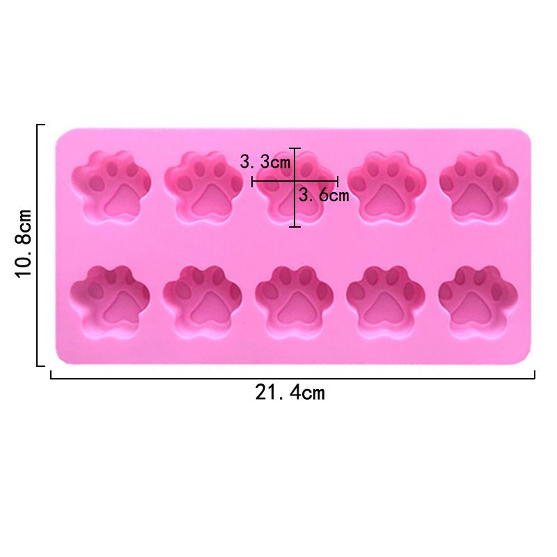 Pink silicone ice tray with mini animal paw print molds for cupcakes, chocolates, soap, or candles featuring dog and cat paw designs.