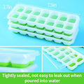 Three green reusable silicone ice cube molds with spill-resistant lids, ideal for whiskey and cocktails, by Everything Baby.