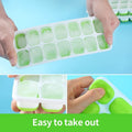 Green reusable silicone ice cube molds with spill-resistant lid, ideal for whiskey and cocktails, by Everything Baby.