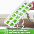 Green reusable silicone 14-ice cube molds with spill-resistant lid, ideal for whiskey and cocktails, by Everything Baby.