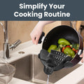 Clip-on cooking strainer with silicone grip, ideal for pasta, vegetables, and ground beef, by Everything Baby.
