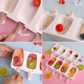 White silicone popsicle molds set with wooden sticks for kids, ideal for making ice pops, cakesicles, and frozen treats.