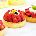 Silver stainless steel crumpet and tart rings for baking, round metal pastry molds for cooking, ideal for pretend play with kids.