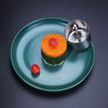 Stainless steel sushi making mold set with round pastry rings and pusher, used for food presentation and shaping sushi or cakes.