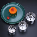 Stainless steel sushi making mold and pastry rings set with pusher, used for food presentation and cake shaping.