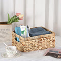 Small handwoven water hyacinth storage basket with handles, decorative wicker bin suitable for organizing toys and household items.
