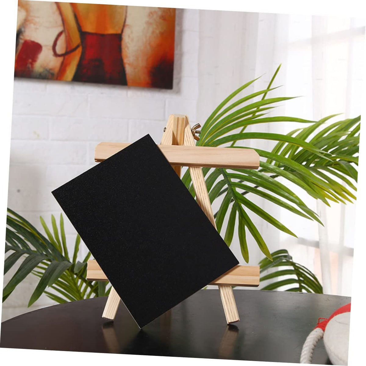 Mini wooden drawing board and chalkboard easel for kids, tabletop stand with whiteboard surface for creative play.