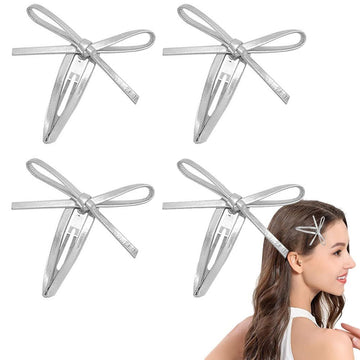 Four silver leather bow hair clips for girls, snap hair clips featuring stylish bowknot design for kids bangs and hair accessories.