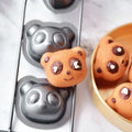 Non-stick cake baking pan with panda and bear molds for muffins, brownies, and cheesecakes, ideal for creative baking.