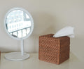 Natural woven rattan tissue box cover in honey brown, square shape with open bottom, designed for facial napkins and baby care.