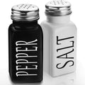 Cute glass salt and pepper shakers set with stainless steel lids, black and white farmhouse style for kitchen table decor.