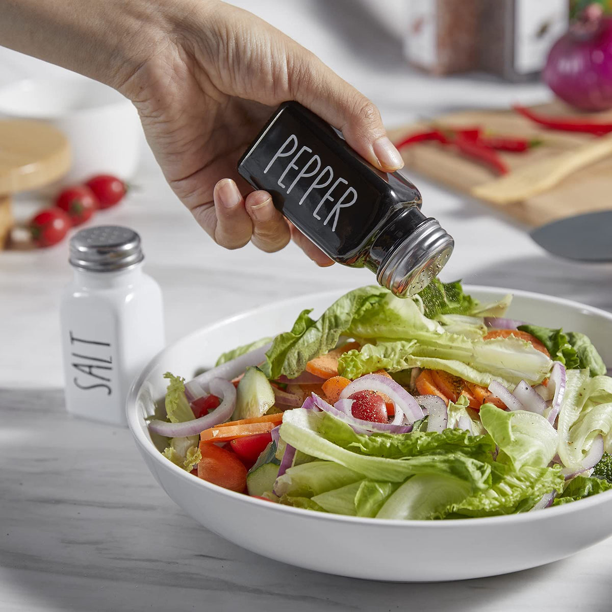 Cute glass salt and pepper shakers set with stainless steel lids, ideal for farmhouse kitchen decor and pretend play for kids