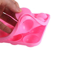 Pink silicone cupcake mold with 20 cavities for cake pops, easy to clean and use, ideal for pretend play and baking fun for kids