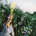 Kids outdoor bubble wands set by Everything Baby, featuring large bubble sticks and tray for pretend play and outdoor fun.