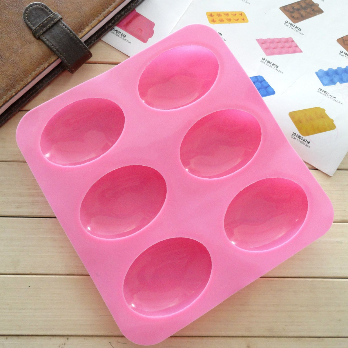 Silicone oval soap mold by Everything Baby, pebble-shaped mold for DIY soap making and craft projects.