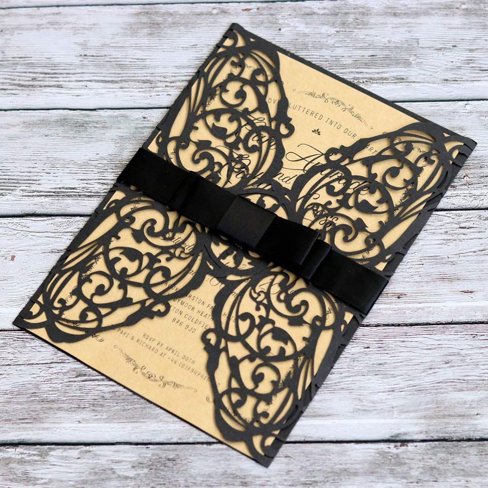 Laser cut Halloween invitation cards in black with hollow designs, part of the 2-piece party invitation set by Everything Baby.