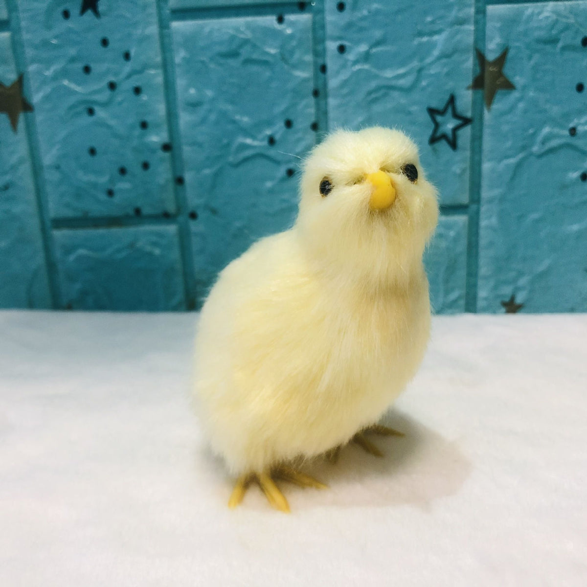 Four realistic plush chick figurines with furry texture, ideal as toy or Easter decoration, from Everything Baby.