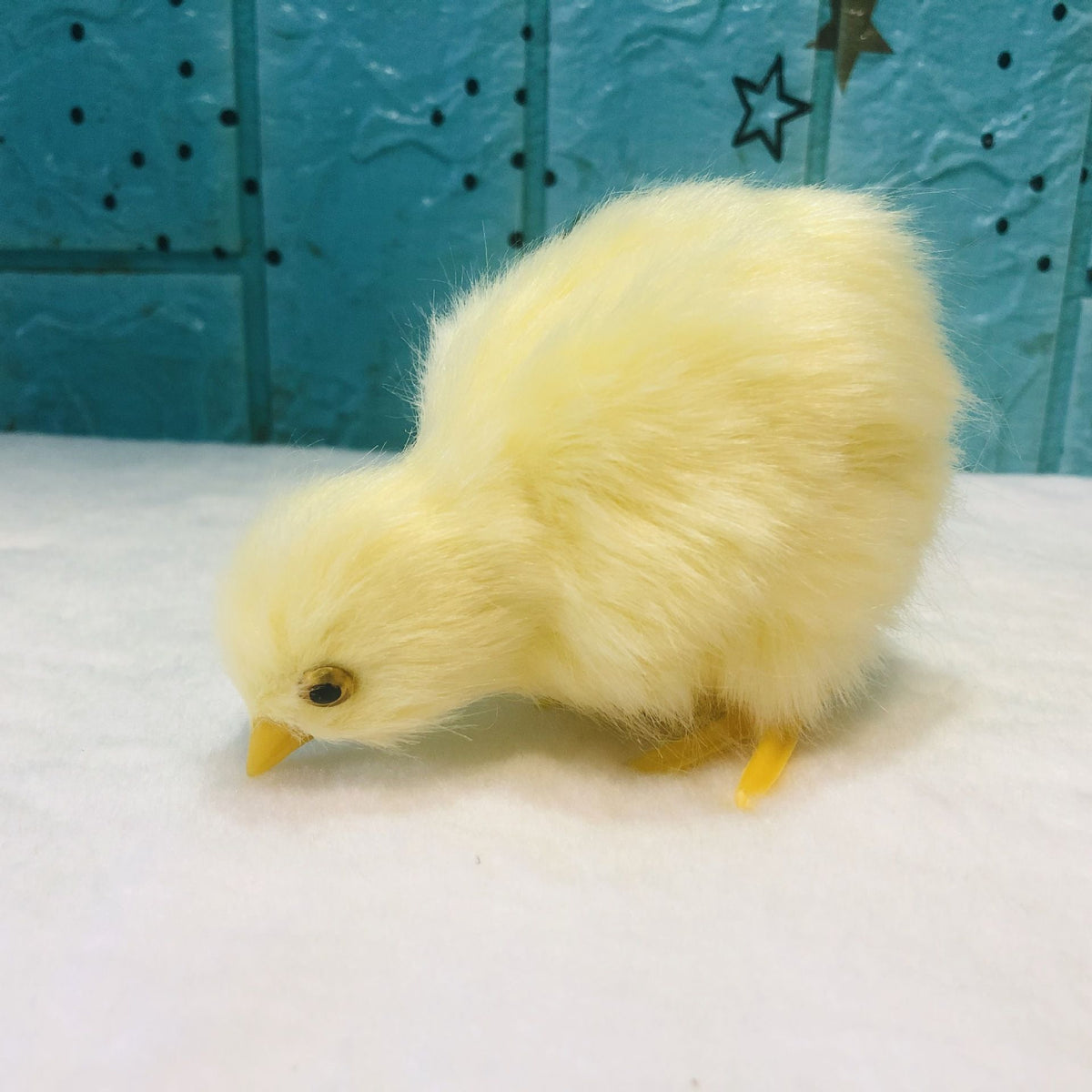 Four realistic plush baby chick figurines with furry texture, suitable for pretend play and Easter-themed photography props.