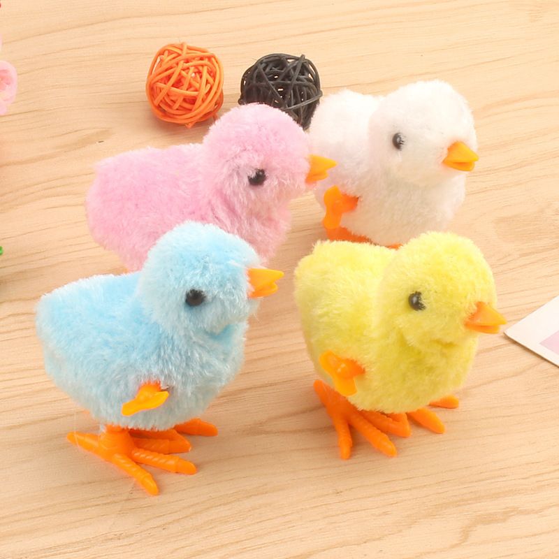 Set of four colorful wind-up chick toys for kids, pretend play baby and kid's Easter decoration by Everything Baby.