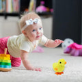Set of four colorful wind-up chick toys for kids, featuring playful baby and kid's pretend play chicken decorations by Everything Baby.
