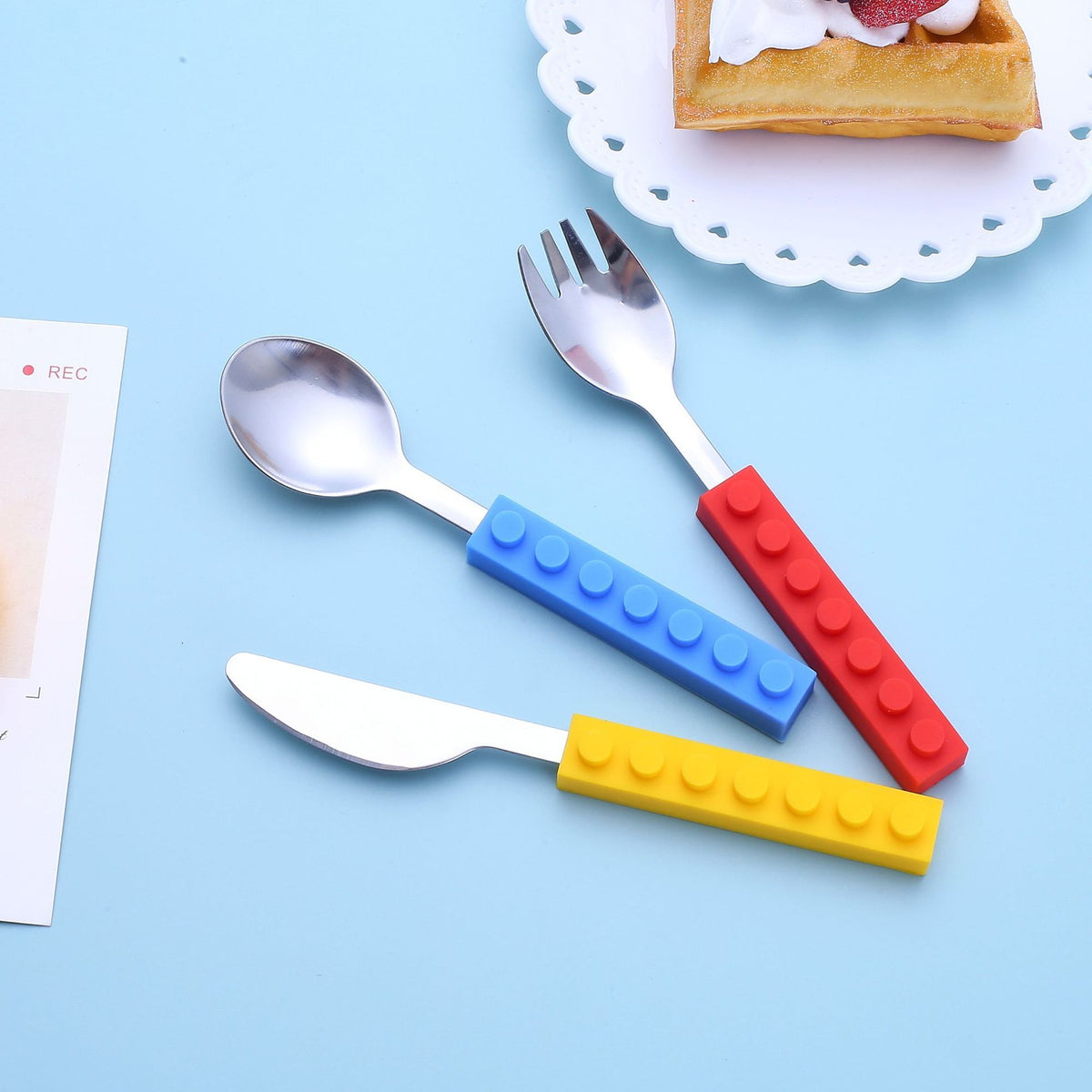 Set of 3 toddler utensils including fork, spoon, and knife with interlocking brick design for kids by Everything Baby.