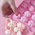 Silicone 24-ice cube tray with spill-resistant lid for freezing and stacking, ideal for baby feeding and cocktail ice.