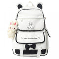 Black Kawaii Girl backpack with plush doll pendant, cute aesthetic schoolbag for teen girls, from Everything Baby.