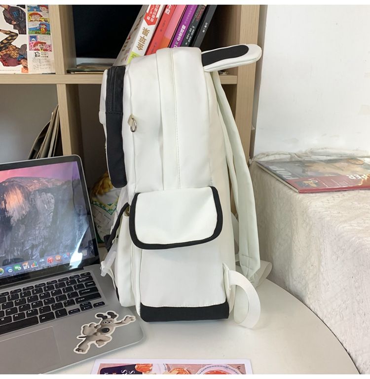 Black kawaii girl backpack with plush doll pendant, cute aesthetic schoolbag for teen girls, from Everything Baby.