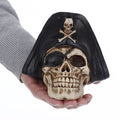 Realistic resin human skull sculpture with pirate details, suitable as a spooky Halloween decoration or toy figure for kids.