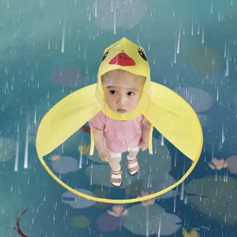 Yellow toddler raincoat with matching umbrella hat, waterproof UFO design for baby girls and boys, perfect for pretend play.
